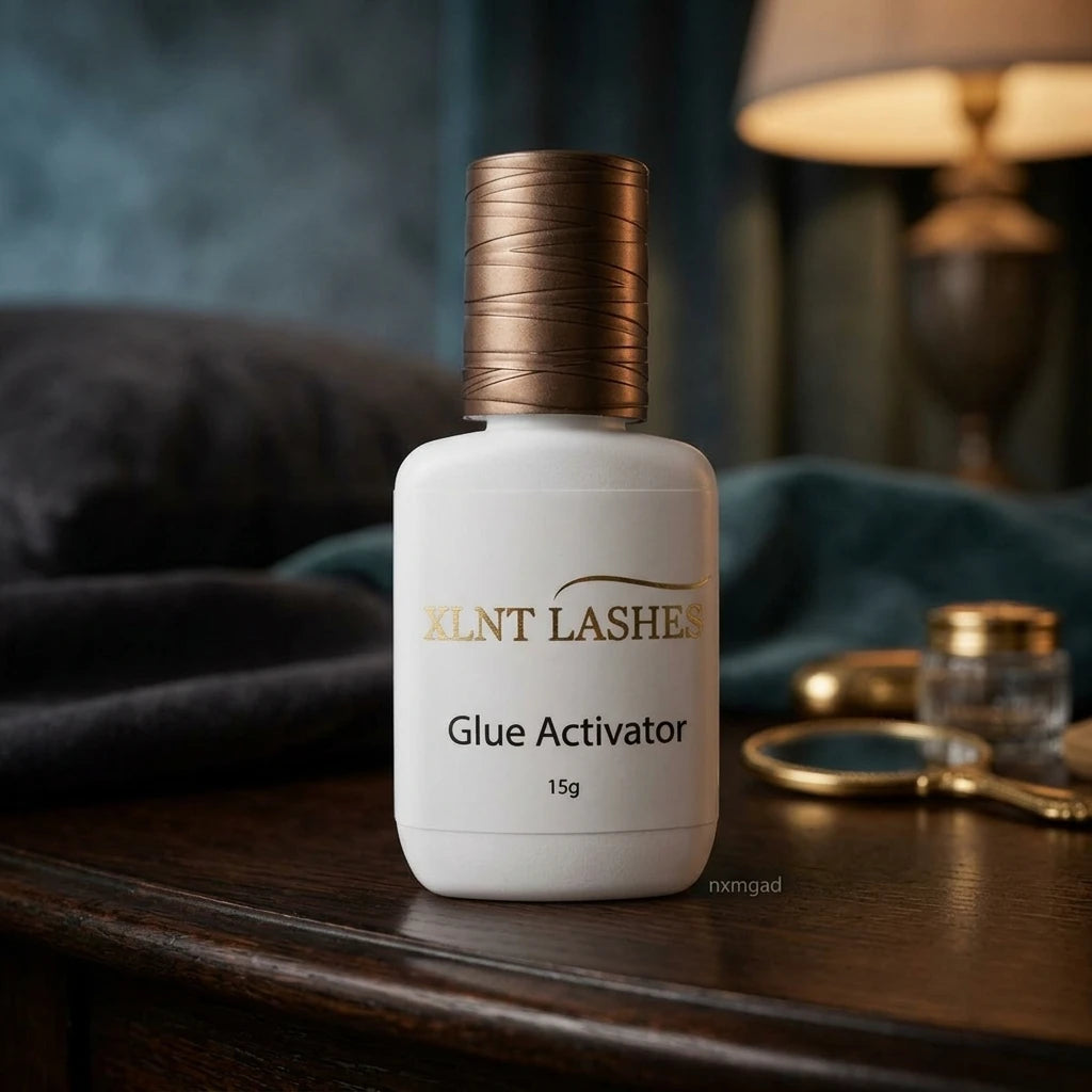 XLNT LASHES Glue Activator 15g eyelash adhesive accelerator bottle with a bronze textured cap.