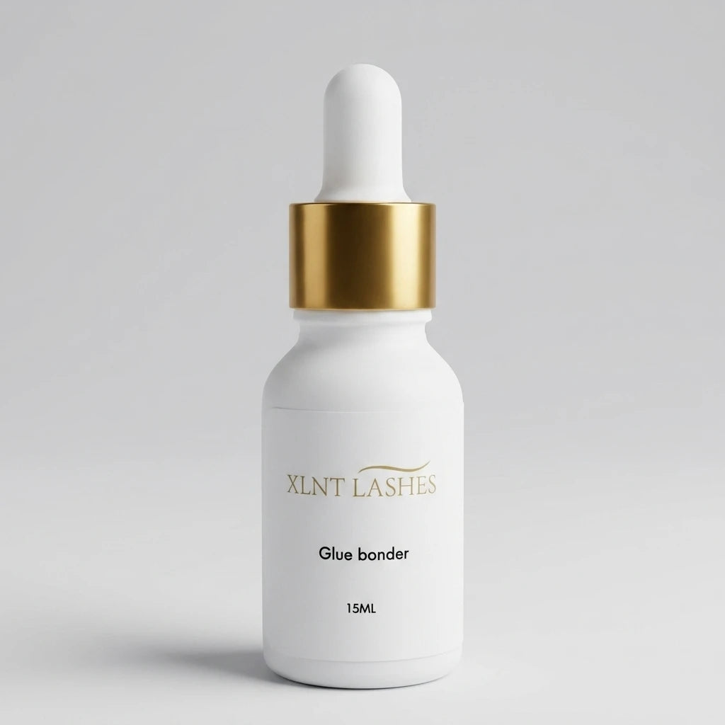XLNT Lashes Glue Bonder 15ml white dropper bottle with gold collar for eyelash extensions.