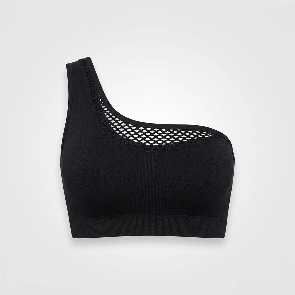 Svart enaxlad seamless sport-bh med meshdetaljer framtill, produktbild mot ljusgrå bakgrund.