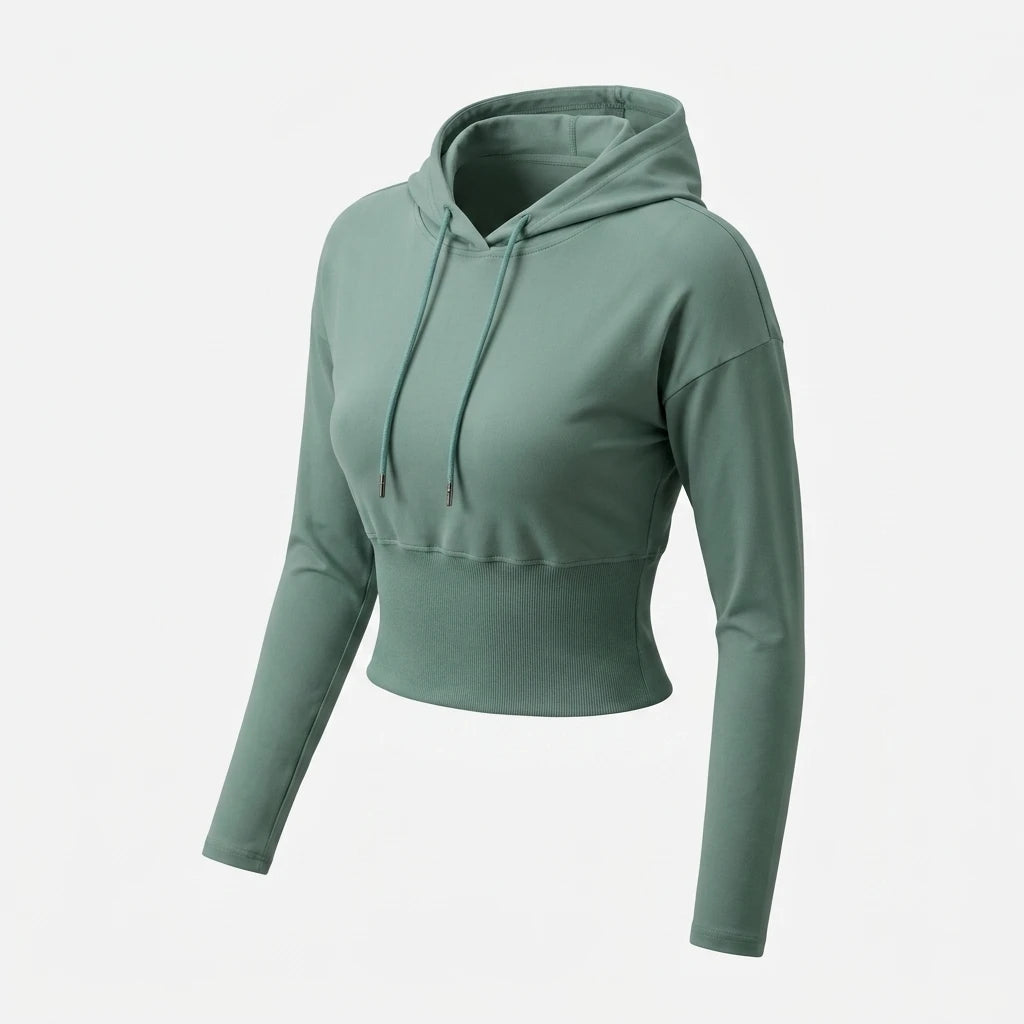 Grön cropped hoodie med lång mudd, huva med dragsko och ribbad midjemudd – produktbild mot vit bakgrund