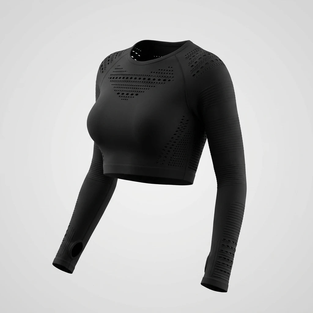 Detaljbild av svart mesh crop top med perforerade ventilationshål och inbyggda tumhål i ärmarna.