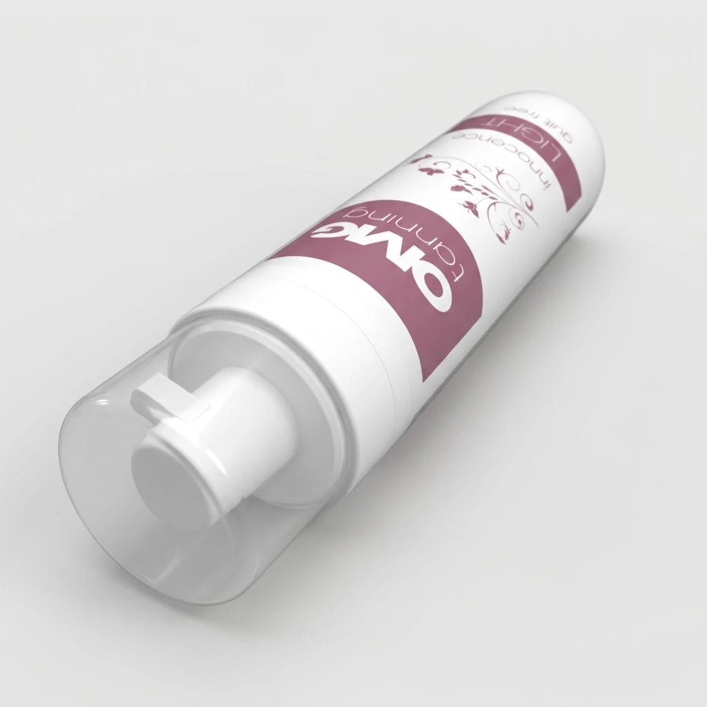 OMG Self Tanning Mousse Innocence Light liggande, vit flaska med rosa text och transparent lock.