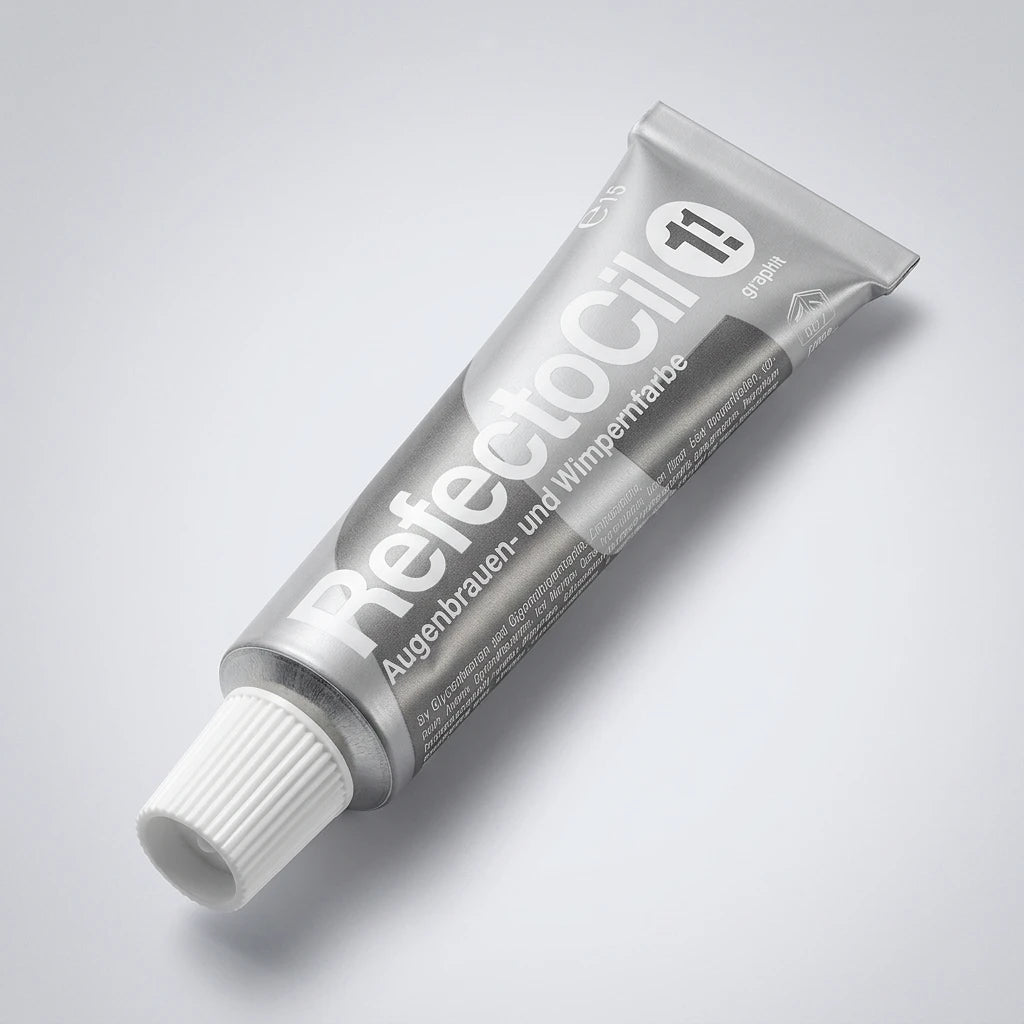 Ovanifrån-vy av RefectoCil Graphite No 1.1 tub i silver med vit skruvkork mot ljusgrå bakgrund.
