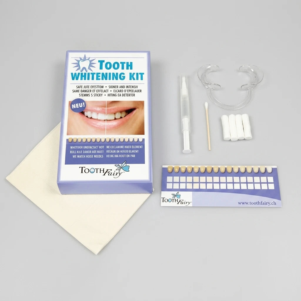 Professionellt Tandblekningsgel No.2 kit med applikatorspruta, färgskala, munöppnare och tillbehör på grå bakgrund.